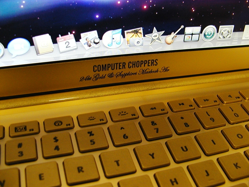 Illustration for article titled Gold MacBook Air Has Bejeweled Rainbow Apple